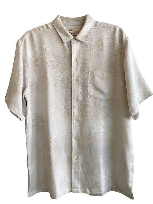 An off-white short-sleeved button-up shirt with a leaf pattern and a collar.